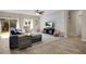 Cozy living room featuring comfortable seating and a decorative accent wall at 445 Kestrel Dr, Groveland, FL 34736