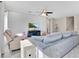 Inviting living room with a comfortable sofa, accent chair, and modern decor at 445 Kestrel Dr, Groveland, FL 34736