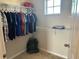 Spacious walk-in closet with double hanging rods and shelving at 445 Kestrel Dr, Groveland, FL 34736