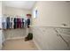 Functional walk-in closet with ample hanging space and shelving at 445 Kestrel Dr, Groveland, FL 34736