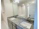 Double vanity bathroom with granite countertop and large mirror at 4450 Sagefield Dr, Harmony, FL 34773