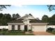 One-story home with a two-car garage and landscaped front yard at 4902 Chase Ct, St Cloud, FL 34772