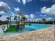 Community pool with water features and a slide at 4902 Chase Ct, St Cloud, FL 34772