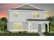 Two-story house with light gray siding, white trim, and landscaping at 5016 Oak Seed Way, St Cloud, FL 34771