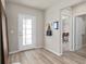 Bright entryway with light wood flooring and access to other rooms at 5026 Starling Bird Ln, St Cloud, FL 34771