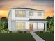 Two-story home with light-colored siding and a walkway at 5026 Starling Bird Ln, St Cloud, FL 34771