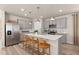 Modern kitchen with stainless steel appliances and a kitchen island at 5026 Starling Bird Ln, St Cloud, FL 34771