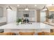 Gray kitchen cabinets, white countertops, and a spacious island at 5026 Starling Bird Ln, St Cloud, FL 34771