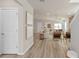 View of living room and kitchen from entryway at 5026 Starling Bird Ln, St Cloud, FL 34771