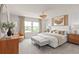 Luxurious main bedroom with a king-size bed and stylish decor at 5026 Starling Bird Ln, St Cloud, FL 34771