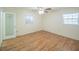 Bedroom with wood flooring and ceiling fan at 512 Jackson St, Eustis, FL 32726