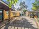 Outdoor patio area with pergola and stone details at 512 Jackson St, Eustis, FL 32726