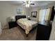 Queen bedroom with ceiling fan and ample closet space at 5298 Wildwood Way, Davenport, FL 33837