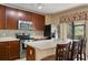 Kitchen boasts stainless steel appliances and an island at 6002 Tivoli Gardens Blvd, Orlando, FL 32829