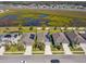 An aerial view of houses, showcasing the lush green surroundings and the neighborhood's serene landscape at 782 Grand Hilltop Dr, Apopka, FL 32703