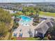 The community pool and clubhouse are surrounded by inviting lounge areas and lush landscaping at 782 Grand Hilltop Dr, Apopka, FL 32703