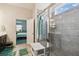 Stylish bathroom featuring a glass-enclosed shower, tiled walls, and vanity with double sinks at 782 Grand Hilltop Dr, Apopka, FL 32703
