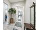 The entryway showcases a neutral color scheme, tiled flooring, and high ceilings, creating a welcoming atmosphere at 782 Grand Hilltop Dr, Apopka, FL 32703