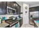 This kitchen features stainless steel appliances, gas range, granite countertops, and plenty of cabinet space at 782 Grand Hilltop Dr, Apopka, FL 32703
