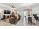 Spacious living room featuring tile flooring, ceiling fan, and sliding door access to the lanai at 782 Grand Hilltop Dr, Apopka, FL 32703