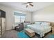 Comfortable main bedroom featuring a ceiling fan, a chair, carpet flooring and a window at 782 Grand Hilltop Dr, Apopka, FL 32703