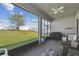 Spacious screened patio with a view of the green backyard at 782 Grand Hilltop Dr, Apopka, FL 32703