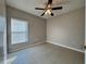 Well lit bedroom with ceiling fan and window blinds at 838 Oglethorpe Ct, Kissimmee, FL 34758