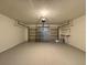 Attached garage with overhead door and storage at 838 Oglethorpe Ct, Kissimmee, FL 34758