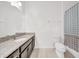 Clean bathroom with single vanity, granite countertop, and shower/tub at 1008 E 10Th St, Apopka, FL 32703