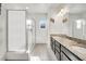Modern bathroom with double vanity, granite countertop, and large shower at 1008 E 10Th St, Apopka, FL 32703