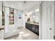 Spa-like bathroom with shower, double vanity, and granite countertop at 1008 E 10Th St, Apopka, FL 32703