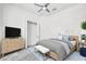 Spacious bedroom with large bed, dresser, and ceiling fan at 1008 E 10Th St, Apopka, FL 32703
