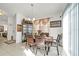 Bright dining room with wood table and chairs near kitchen at 1008 E 10Th St, Apopka, FL 32703