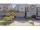 Townhome exterior with two-car garage and front yard at 1008 E 10Th St, Apopka, FL 32703