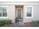 Inviting front entrance with small patio seating area at 1008 E 10Th St, Apopka, FL 32703