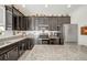 Updated kitchen with granite countertops and dark cabinetry at 1008 E 10Th St, Apopka, FL 32703