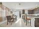 Kitchen with dark cabinets, granite counters, and breakfast bar at 1008 E 10Th St, Apopka, FL 32703
