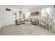 Spacious living room with gray sofas, glass coffee table, and piano at 1008 E 10Th St, Apopka, FL 32703