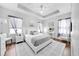 Spacious main bedroom with wood floors and gray bedding at 1008 E 10Th St, Apopka, FL 32703