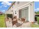 Private patio with wicker furniture, perfect for relaxing at 1008 E 10Th St, Apopka, FL 32703