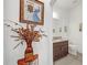 Small half bathroom with granite vanity and decorative vase at 1008 E 10Th St, Apopka, FL 32703