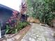 Spacious backyard featuring brick pavers, mature trees and foliage offering a private outdoor retreat at 1138 Easton St, Orlando, FL 32825