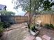 Backyard featuring brick pavers, mature trees and foliage offering a private outdoor retreat at 1138 Easton St, Orlando, FL 32825