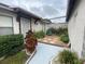 Charming courtyard with stone, gravel, and lush tropical landscaping offers a private outdoor space at 1138 Easton St, Orlando, FL 32825