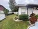 Charming home with well-maintained landscaping, green grass, and white picket fence at 1138 Easton St, Orlando, FL 32825