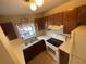 This cozy kitchen offers essential appliances, cabinetry, and a functional layout for cooking and storage at 1138 Easton St, Orlando, FL 32825