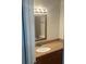 Bathroom with granite countertop, single sink, and mirror at 11568 Westwood Blvd # 1034, Orlando, FL 32821