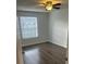 Bright bedroom with laminate flooring and window coverings at 11568 Westwood Blvd # 1034, Orlando, FL 32821