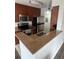 Modern kitchen featuring granite countertops and stainless steel appliances at 11568 Westwood Blvd # 1034, Orlando, FL 32821