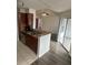 Open kitchen with granite counters, stainless steel appliances, and breakfast bar at 11568 Westwood Blvd # 1034, Orlando, FL 32821